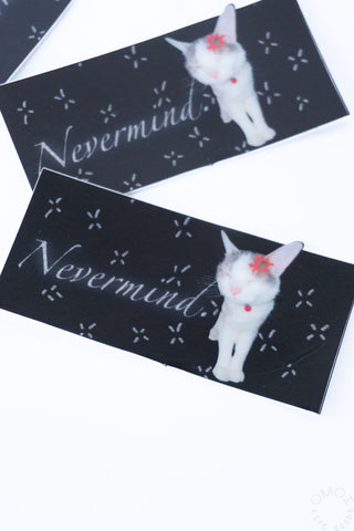 Set of vinyl stickers: two black rectangles with white cat “Nevermind” and sparkle designs