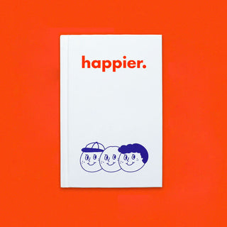 White diary notebook with "happier." title and blue face illustration on cover