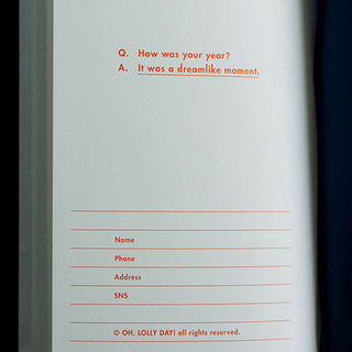 Open diary notebook page with "How was your year?" prompt and contact fields