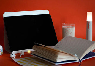 Open diary notebook with black cover and lined pages