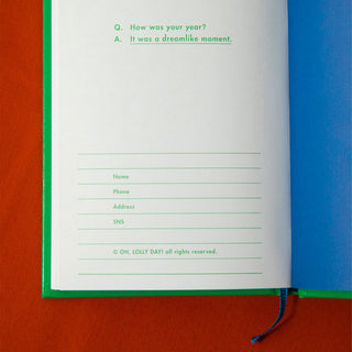 White notebook pages with printed questionnaire lines and fields, green spine