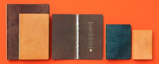 The 5 PLOTTER sizes of leather binder lined up for visual comparison on an orange background.