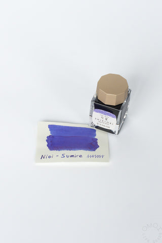 Nioi-Sumire bottled ink with purple swatch card and clear bottle with gold cap