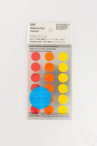 Circular masking tape dots set with red, orange, yellow dots and a blue label