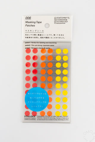 Circular masking tape dots set with red, orange, yellow dots and blue circle accent