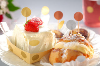 Dessert with strawberry and fruit skewers, decorated in colorful balloon shapes
