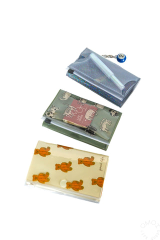 Small zip pouches with transparent pockets, featuring holographic and animal prints