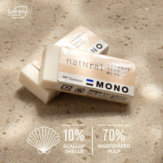 Tombow MONO natural eraser blocks with wrapper on textured paper surface