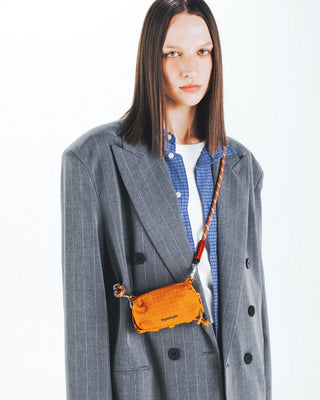 Topologie 8mm orange helix rope strap worn crossbody with gold hardware