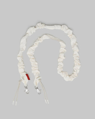 Ecru ruched bungee strap with silver lobster clasps and adjustable cord ends