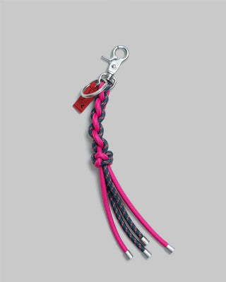 Teal and pink braided keychain with metal clasp and four tassel ends