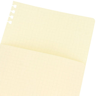 Cream refill pages with fine grid pattern and rounded top tabs