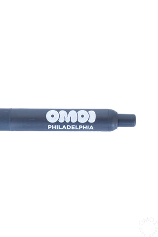 Blue pen barrel close-up with OMOI Philadelphia logo