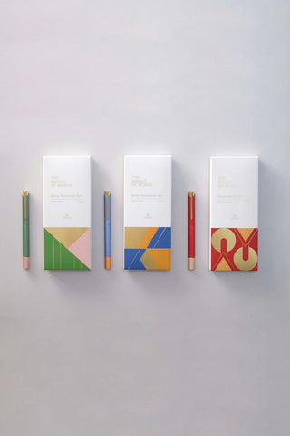 Rollerball pen set with green, blue, and red barrels and matching gift boxes