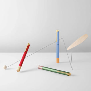 Colored rollerball pens: blue standing, red leaning, green lying