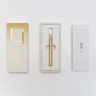 Gold brass dip pen in box with protective packaging and included accessory