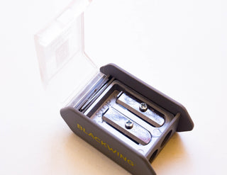 Blackwing two-step pencil sharpener, open with cutting chamber and blade visible