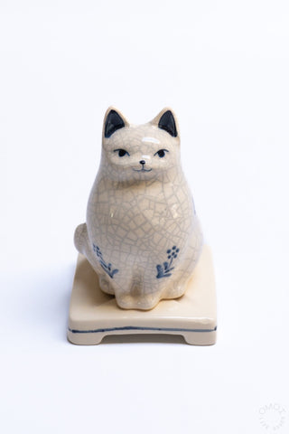 Crackle porcelain cat incense burner with blue flower details and square base