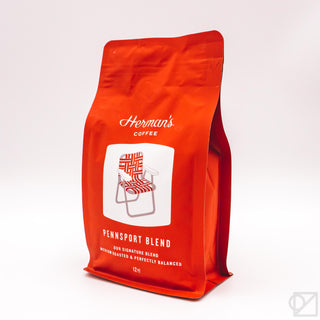 Red stand-up coffee bag with Herman's Coffee logo and Pennsport Blend label