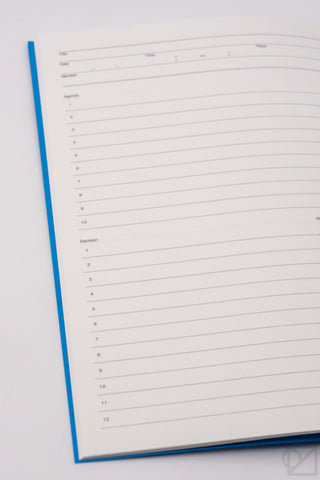 Close-up of A5 lined notebook pages with blue border and numbered rows.