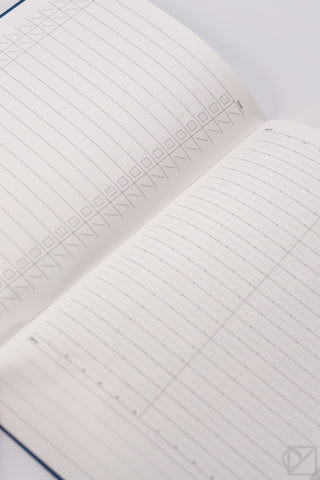 A5 spreadsheet notebook pages with grid layout and subtle title pattern near the top.