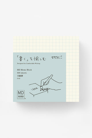 Grid memo pad block with blue MD PAPER label and hand-drawn writing icon.