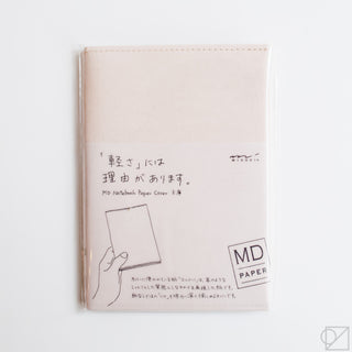 Beige notebook paper cover with printed instructions and MD PAPER logo badge