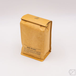 Whole bean coffee blend kraft bag with folded top and back panel text