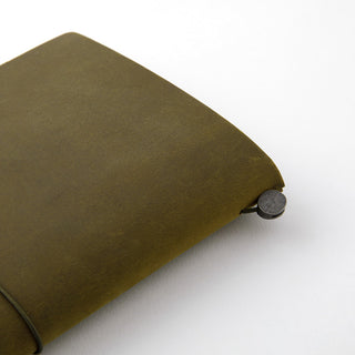 Olive notebook cover corner with round snap button and stitched edge