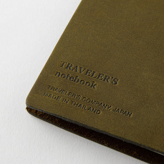 Olive notebook cover with embossed TRAVELER'S notebook text and Made in Thailand