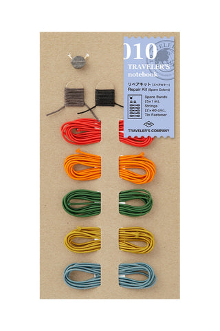 Traveler's notebook repair kit with spare color strings, tags, and tools