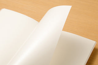 Traveler's notebook sticker release paper, folded sheet showing lifted sticker backing