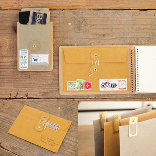 Orange-brown kraft envelopes set with front flap and string/buttonhole closure
