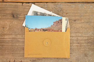 Orange kraft envelope holding a photo print