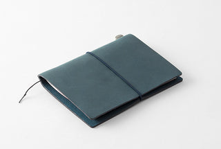 Blue leather passport-size notebook with elastic closure band and metal button