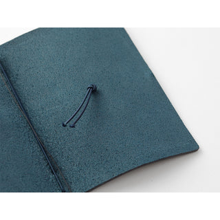 Blue leather passport notebook cover with tied drawstring cord on front