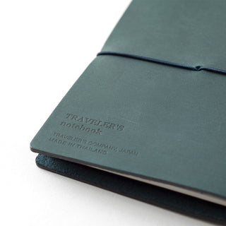Blue leather passport notebook cover with embossed branding and Made in Thailand text