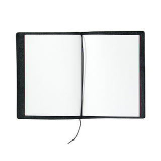 Black passport notebook open to two blank white pages with a tied cord