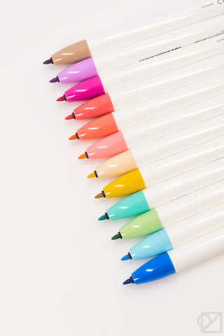 Retractable marker pens displaying 12 pastel color tips in a row