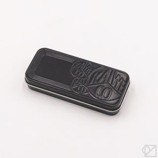 Black metal storage tin with embossed Kaweco branding for fountain pen set.