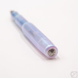 Iridescent pearl pen cap end with silver emblem and iridescent blue finish