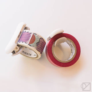 Karu-Cut tape clip with decorative washi tape rolls, including red stripes