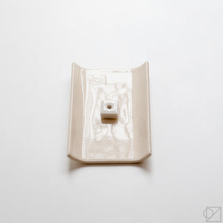 Top view of white incense burner tray with central square stick holder