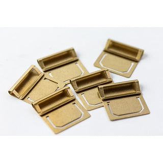 Brass index clip pieces, open tabs with rectangular label frames, assorted angles