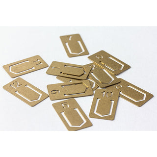 Brass number clip pieces with assorted digits, rectangular metal tabs