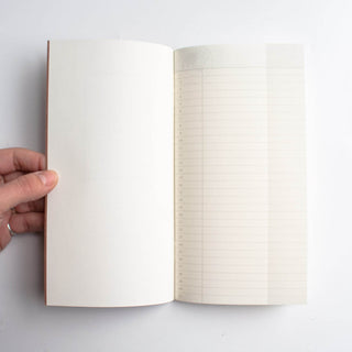 Open Traveler's notebook with grid pages and brown cover