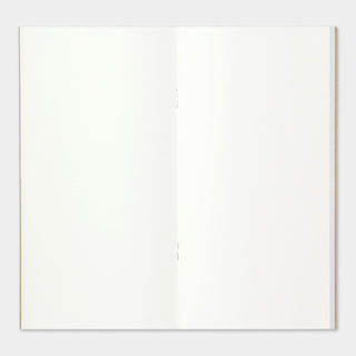 Open camel-brown notebook showing two blank cream pages