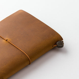 Camel brown leather notebook with stitched cord tie and round button fastening