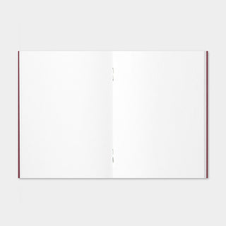 Open blank notebook with white pages and red-edged binding