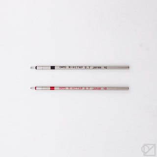 Two ballpoint pen refills, 0.7mm tips, silver barrels with black and red bands
